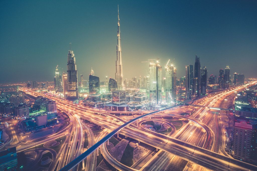 Dubai skyline at night with beautiful city with lights close to it's busiest highway shutterstock_427109158.jpg